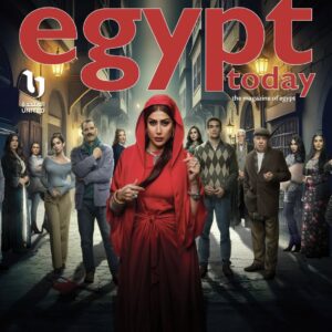 Cover of Egypt Today magazine featuring a woman in a red hooded dress standing confidently in the center, surrounded by a diverse group of men and women on a dimly lit street. | Mendy Beauty.